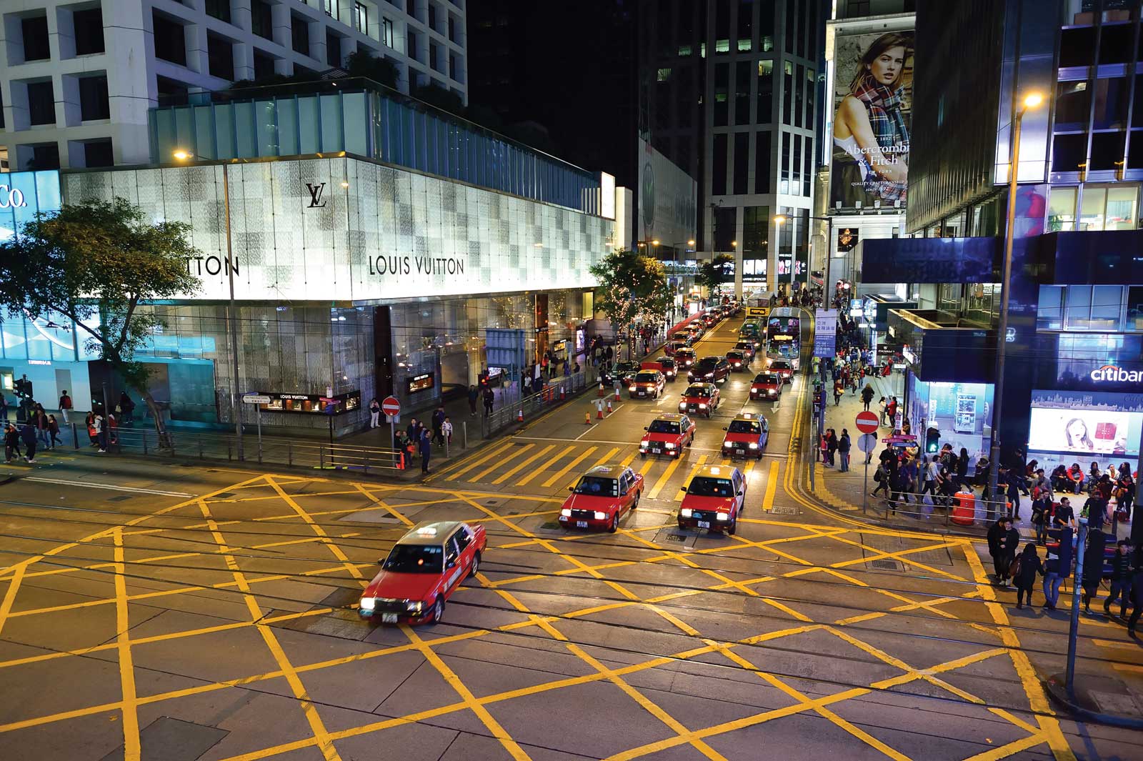 Hong Kong street with taxis at night