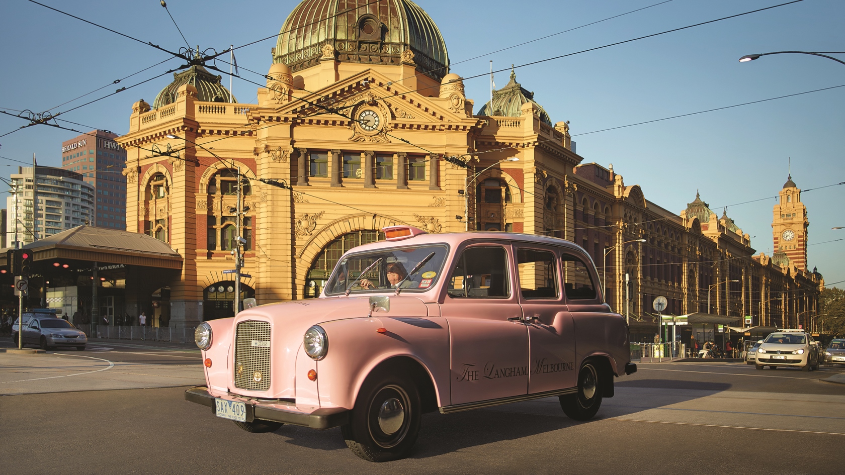 The pink taxi in front of the Langham, Melbourne