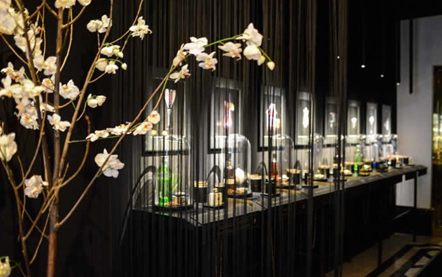 Ingredients and perfumes are presented beneath an image of how the finished cocktail will be presented