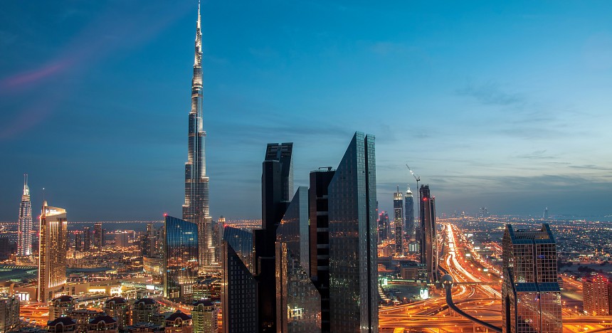 The city of Dubai at night with the Burj Khalifa