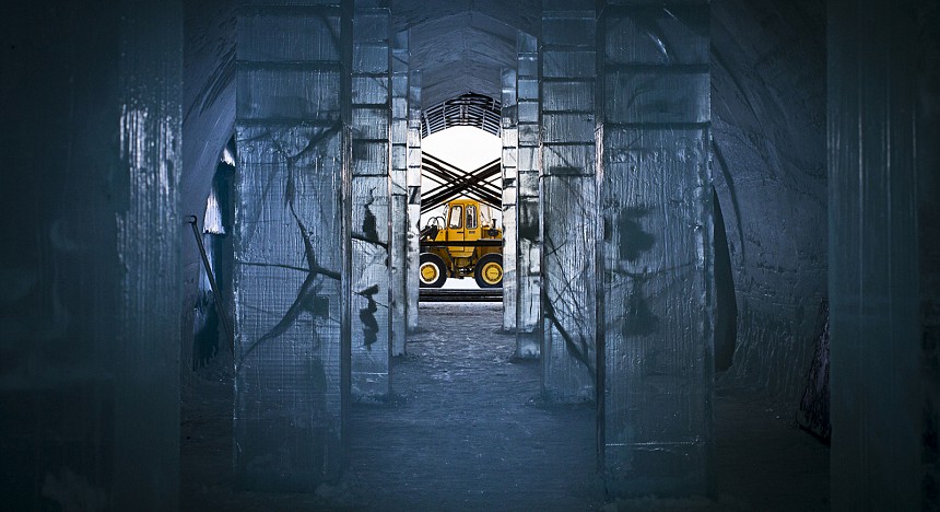 Heavy work: a construction vehicle in view through the main hall