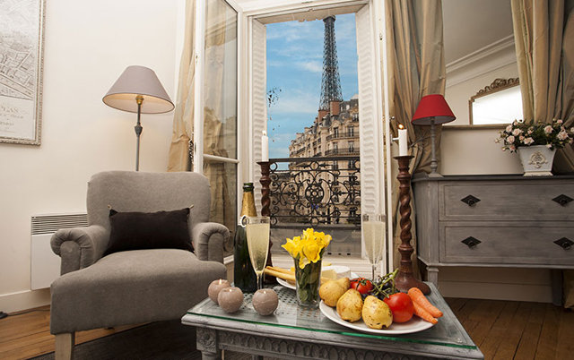 Volnay combines unobstructed views of the Eiffel Tower via five sets of French doors with Parisian decoration