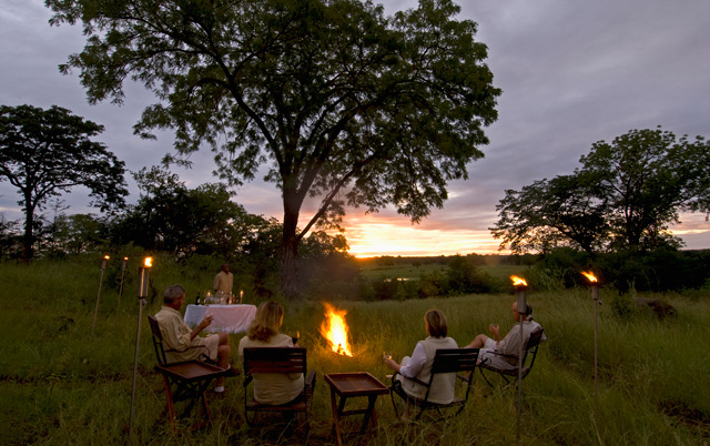 Sunset drinks at Sanctuary Chichele presidential lodge in Zambia