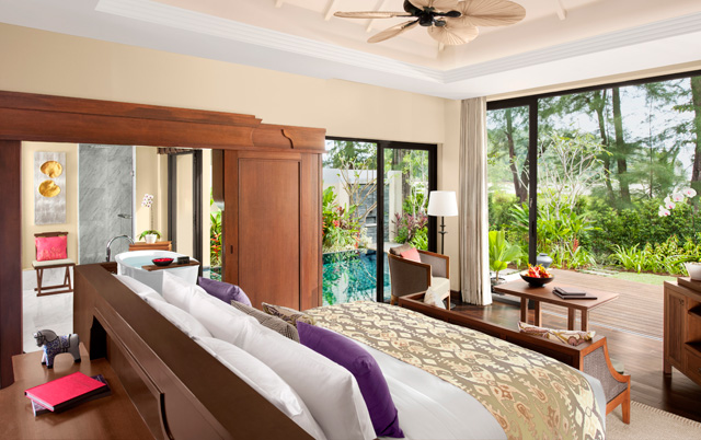 Bedroom at the villa opens onto the beach and a private pool
