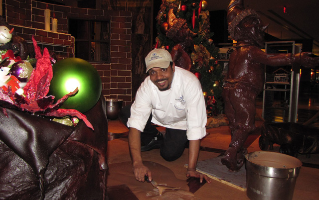 Pastry chef Mahesh Weerasinghe creating the milk chocolate floor