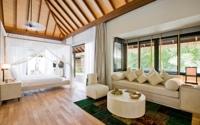 Bedroom and lounge at one of the resort's luxury villas
